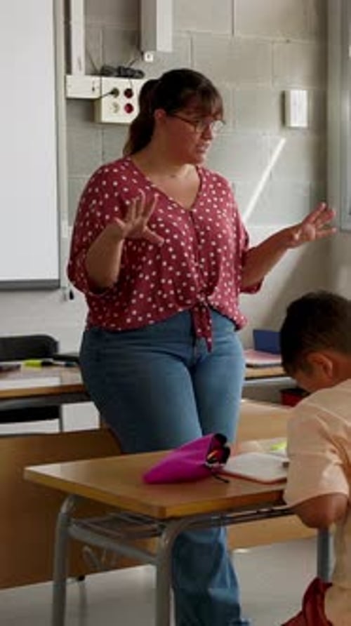 Enthusiastic Teacher Giving Lesson to High School Students