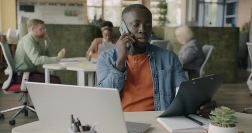 Young Adult Working in Modern Office Space