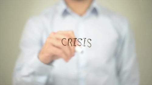 Writing Crisis on Clear Surface in Close Up