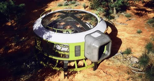 Futuristic Structure in a Desert Landscape Surrounded By Trees