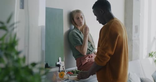 Couple Preparing Vegetables Together in Kitchen