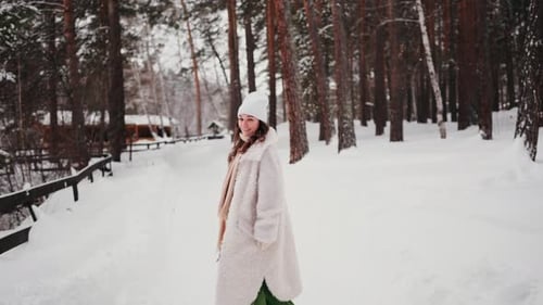 Happy Woman Smiling and Walking Outdoors Having Fun During Winter Holidays Pleasure and Travel