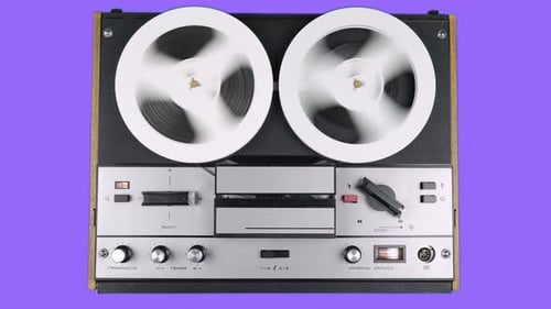 Vintage Reel-to-Reel Tape Recorder in Operation