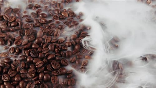 Steaming Coffee Beans with Gentle Billowing Smoke