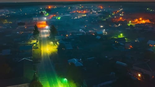Flight Above Town Cityscape Skyline In Autumn Evening Night