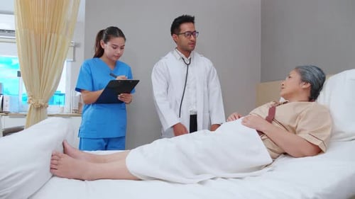 Specialist doctor man and nurse explaining and check with elderly patient in hospital.
