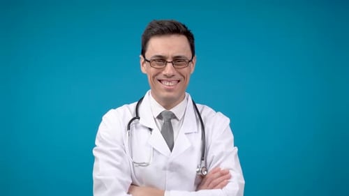 Smiling Doctor in Lab Coat with Arms Folded