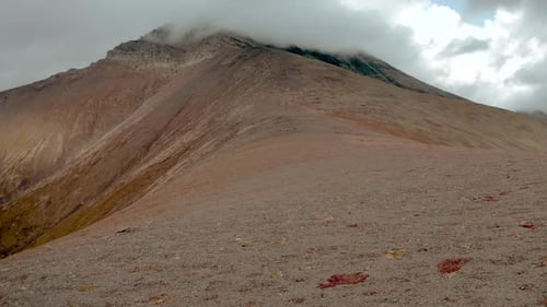 Moving Up to the Peak of a Mountain Close to the Ground