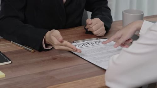 Reviewing Contract in Professional Workplace Setting