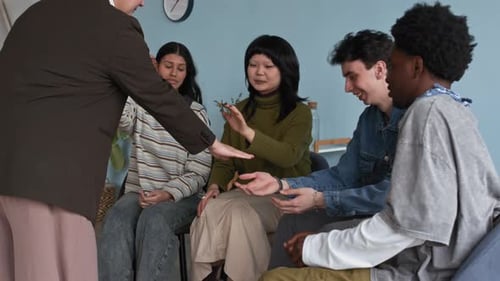 Diverse Group of Young Adults Teamwork Exercise Indoors