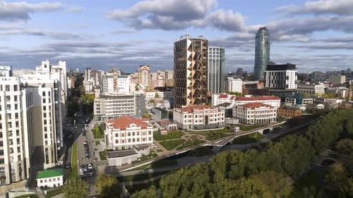 Summer view of a huge city with glass offices and multi-storey buildings