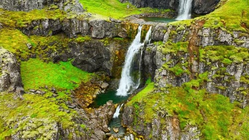 Wispy Waterfalls Flowing Over Cliff Mountain River Falling Over Cliff Creating Many Waterfalls with