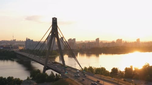 Aerial View of River Bridge with Moderate Car Traffic in High Speed Motion
