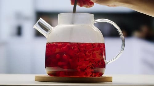 Frozen Cranberries Cooking for Tea or Jam Background Close Up of Cranberry Berries in on the Kitchen
