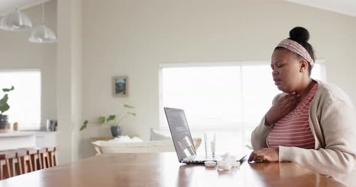 Woman Feeling Sick Video Conferencing with Doctor