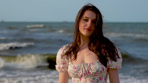 Happy Woman at Sea Beach Touching Long Hair at Sunset Close Up Carefree Female is Enjoying Freedom