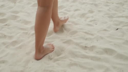 Caucasian Woman Closeup Island Sand Footsteps Textured Grains Under Toes Deliberate Slow Steps