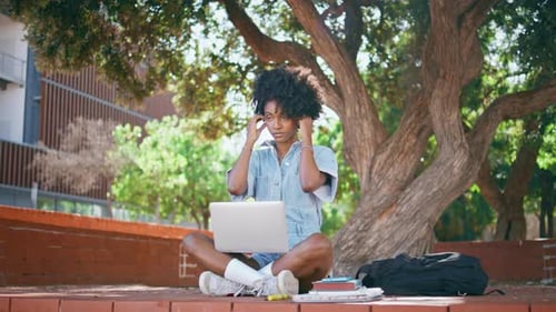 Woman Student Working Outdoors on Campus