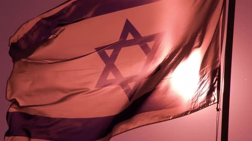 Israeli Flag Waving in Pink Sky at Sunrise