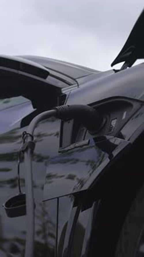 A Closeup View of a Modern Electric Vehicle Charging Station Showcasing Its Advanced Features