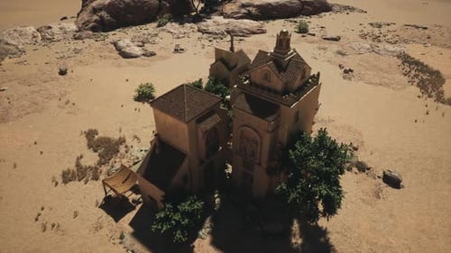 Perspective aérienne lointaine d'une oasis clairsemée et d'une forteresse aride
