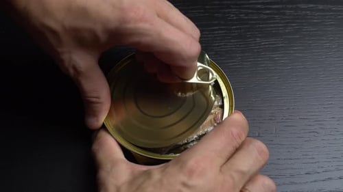 Opening a Can of Anchovies, Close Up