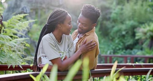 Happy, garden and black couple with connection in nature for romance date on vacation or holiday