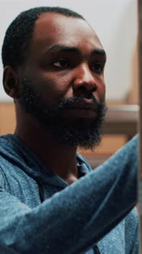 Vertical Video African American Worker Using Scanner and Tablet to Check Stock Inventory