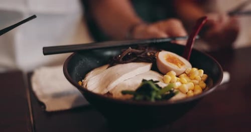 Food, japanese or cuisine with bowl at restaurant for ramen, nutrition or healthy meal on table