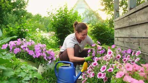 Gardening and Agriculture Concept Young Woman Farm Worker Gardening Flowers in Garden Gardener