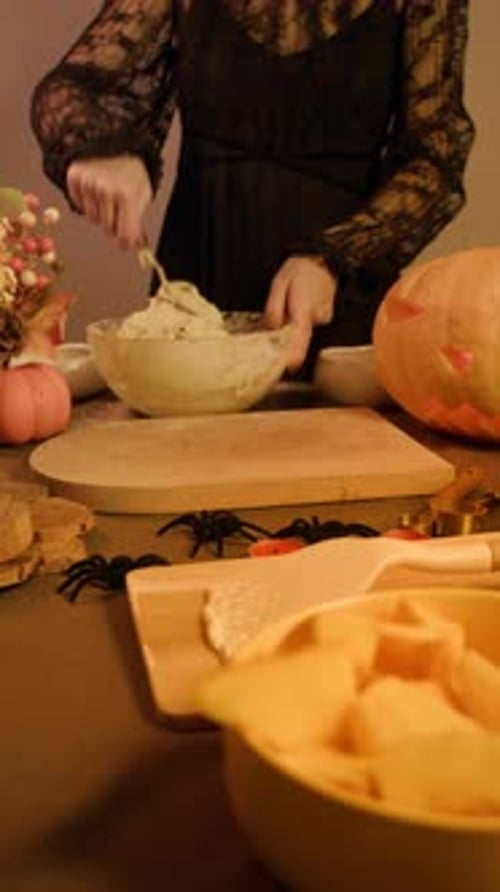 Thick Dough for Festive Pumpkin Pie Being Mixed on Table Surrounded By Autumn d Cor and Candles Mini