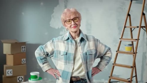 Senior Woman Poses Confidently in Home Renovation Scene