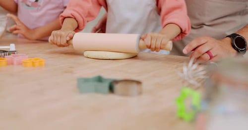 Children and Adult Rolling Dough With Rolling Pin