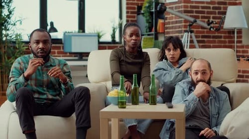 Friends Watching TV Together, Reacting to Intense Scene