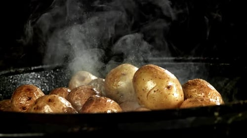 The Potatoes are Fried in a Large Frying Pan Filmed on a Highspeed Camera at 1000 Fps