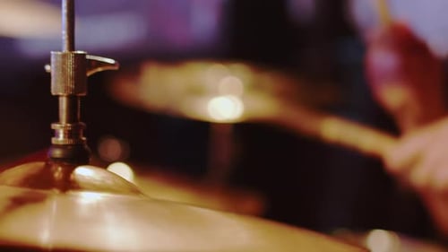 Drummer Hits Cymbals in Close Up Shot