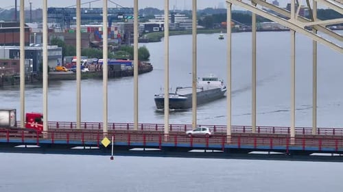 Cargo Ship Sailing On The River In Alblasserdam, Netherlands - Aerial Drone Shot