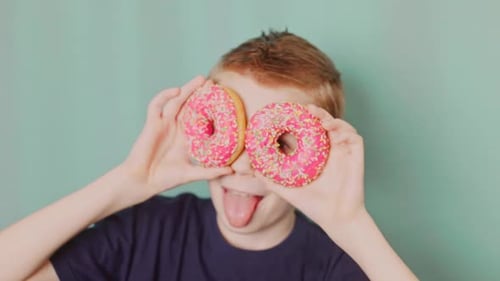 Boy Uses Donuts Like the Eyes