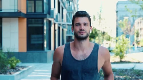 Young Adult Man Jogging in Urban Setting