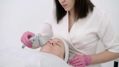 Professional Face Lift Antiage Procedure SMAS Ultrasound Treatment to a Calm Female Beauty Clinic