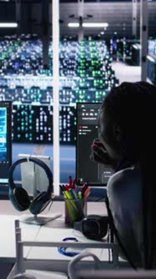 Vertical Video Teamworking Engineers Brainstorming in Data Center Reviewing AI Diagnostics