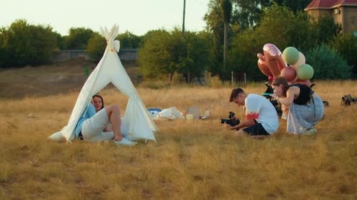 Photographer Shoots Happy Birthday of Baby and Family Lifestyle and Autumn Sunset with Tent in Field