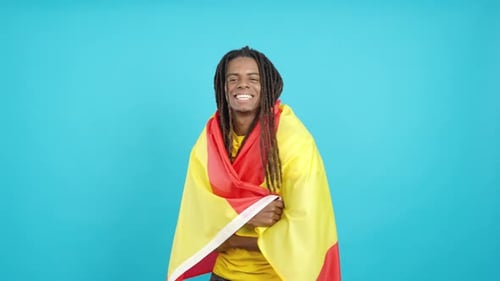 Man Smiling Wrapped in Spanish Flag