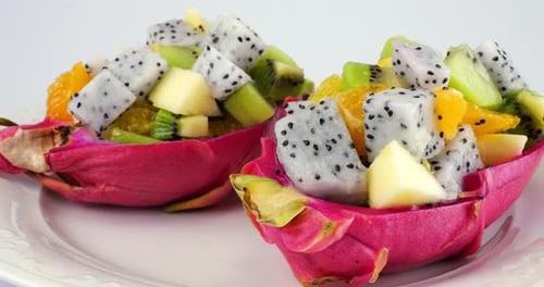 Colorful Tropical Fruit Salad in Dragon Fruit Bowls