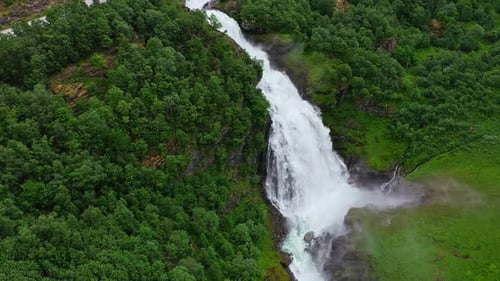 Aerial view of waterfall cascading down, Norway.