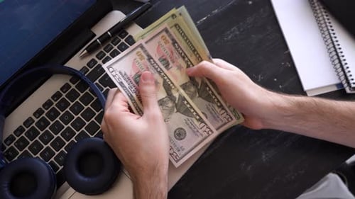 Counting USD Money, Close-up on Dark Office Desk