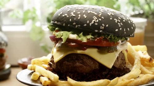 Black Burger with Fries on a Plate Dolly