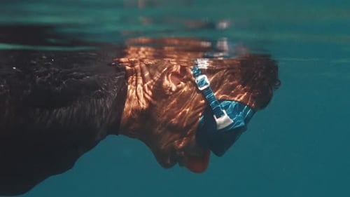 Freediver Swims in the Tropical Sea Close Up View of the Diver