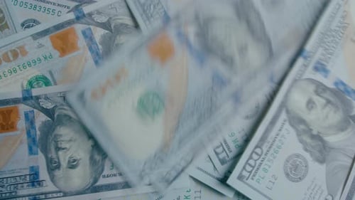 Time Lapse of US Dollar Banknotes Falling Down