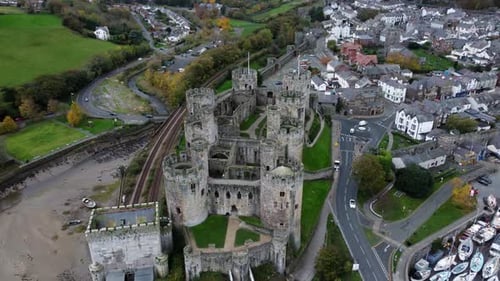 Historic Conwy castle aerial view of Landmark town ruin stone wall battlements tourist attraction hi